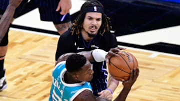 ORLANDO, FLORIDA - JANUARY 25: Bismack Biyombo #8 of the Charlotte Hornets looks to pass the ball as Cole Anthony #50 of the Orlando Magic defends during the first quarter at Amway Center on January 25, 2021 in Orlando, Florida. NOTE TO USER: User expressly acknowledges and agrees that, by downloading and or using this photograph, User is consenting to the terms and conditions of the Getty Images License Agreement. (Photo by Douglas P. DeFelice/Getty Images)