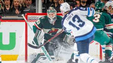 ST. PAUL, MN - APRIL 17: Devan Dubnyk #40 of the Minnesota Wild defends his goal against Brandon Tanev #13 of the Winnipeg Jets in Game Four of the Western Conference First Round during the 2018 NHL Stanley Cup Playoffs at the Xcel Energy Center on April 17, 2018 in St. Paul, Minnesota. (Photo by Bruce Kluckhohn/NHLI via Getty Images)