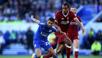 LEICESTER, ENGLAND - SEPTEMBER 23: Joel Matip of Liverpool pulls back Riyad Mahrez of Leicester City during the Premier League match between Leicester City and Liverpool at The King Power Stadium on September 23, 2017 in Leicester, England. (Photo by Laurence Griffiths/Getty Images)