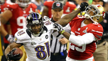 NEW ORLEANS, LA - FEBRUARY 03: Anquan Boldin #81 of the Baltimore Ravens runs with the ball and stiff arms Chris Culliver #29 of the San Francisco 49ers after catching a pass in the second half during Super Bowl XLVII at the Mercedes-Benz Superdome on February 3, 2013 in New Orleans, Louisiana. (Photo by Al Bello/Getty Images)