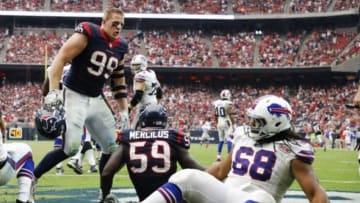Sep 28, 2014; Houston, TX, USA; Houston Texans defensive end J.J. Watt (99) yells at Buffalo Bills guard Cyril Richardson (68) during the game at NRG Stadium. Mandatory Credit: Kevin Jairaj-USA TODAY Sports
