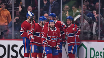 MONTREAL, QC - NOVEMBER 05: Victor Mete #53 of the Montreal Canadiens (C) celebrates a goal with teammates against the Boston Bruins during the first period at the Bell Centre on November 5, 2019 in Montreal, Canada. The Montreal Canadiens defeated the Boston Bruins 5-4. (Photo by Minas Panagiotakis/Getty Images)