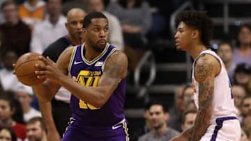 PHOENIX, ARIZONA - MARCH 13: Derrick Favors #15 of the Utah Jazz looks to pass around Kelly Oubre Jr. #3 of the Phoenix Suns during the first half of the NBA game at Talking Stick Resort Arena on March 13, 2019 in Phoenix, Arizona. (Photo by Christian Petersen/Getty Images)