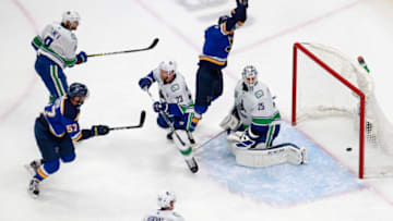 EDMONTON, ALBERTA - AUGUST 14: David Perron #57 of the St. Louis Blues scores with seven seconds left in the third period against the Jacob Markstrom #25 of the Vancouver Canucks to tie the score at 3-3 in Game Two of the Western Conference First Round during the 2020 NHL Stanley Cup Playoffs at Rogers Place on August 14, 2020 in Edmonton, Alberta, Canada. (Photo by Jeff Vinnick/Getty Images)