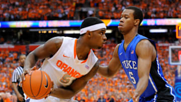 SYRACUSE, NY - FEBRUARY 01: C.J. Fair #5 of the Syracuse Orange scans the court against the defense of Rodney Hood #5 of the Duke Blue Devils during the first half at the Carrier Dome on February 1, 2014 in Syracuse, New York. Syracuse defeated Duke 91-89 in overtime. (Photo by Rich Barnes/Getty Images)