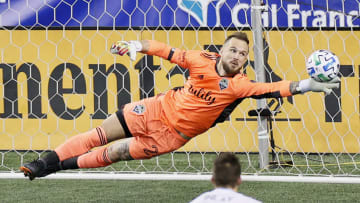 SEATTLE, WASHINGTON - DECEMBER 07: Stefan Frei #24 of Seattle Sounders dives for the ball as the Minnesota United scores in the first half during the Western Conference Final of the MLS Cup Playoffs at Lumen Field on December 07, 2020 in Seattle, Washington. The Sounders won 3-2. (Photo by Steph Chambers/Getty Images)