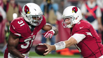 Aug 12, 2016; Glendale, AZ, USA; Arizona Cardinals quarterback Carson Palmer (3) hands off to running back David Johnson (31) during the first half against the Oakland Raiders at University of Phoenix Stadium. Mandatory Credit: Matt Kartozian-USA TODAY Sports