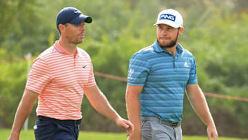 ABU DHABI, UNITED ARAB EMIRATES - JANUARY 23: Rory McIlroy of Northern Ireland and Tyrrell Hatton of England talk on the 8th hole during Day Three of the Abu Dhabi HSBC Championship at Abu Dhabi Golf Club on January 23, 2021 in Abu Dhabi, United Arab Emirates. (Photo by Andrew Redington/Getty Images)