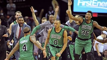 Feb 5, 2016; Cleveland, OH, USA; The Boston Celtics celebrate after guard Avery Bradley (0) reacts after hitting a three-point shot to end the game and beat the Cleveland Cavaliers at Quicken Loans Arena. The Celtics won 104-103. Mandatory Credit: Ken Blaze-USA TODAY Sports