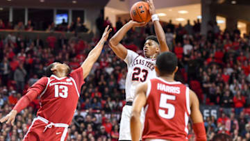 LUBBOCK, TX - JANUARY 26: Jarrett Culver #23 of the Texas Tech Red Raiders shoots the ball over Mason Jones #13 of the Arkansas Razorbacks during the second half of the game on January 26, 2019 at United Supermarkets Arena in Lubbock, Texas. Texas Tech defeated Arkansas 67-64. (Photo by John Weast/Getty Images)