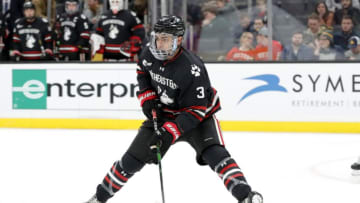 BOSTON, MA - FEBRUARY 03: Northeastern University Huskies defenseman Jayden Struble (3) holds the puck during a Beanpot semi-final between the Harvard Crimson and the Northeastern Huskies on February 3, 2020, at TD garden in Boston, Massachusetts. (Photo by Fred Kfoury III/Icon Sportswire via Getty Images)
