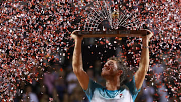 RIO DE JANEIRO, BRAZIL - FEBRUARY 25: Diego Schwartzman of Argentina celebrates with the trophy after defeating Fernando Verdasco of Spain at the singles final of the ATP Rio Open 2018 at Jockey Club Brasileiro on February 25, 2018 in Rio de Janeiro, Brazil. (Photo by Buda Mendes/Getty Images)