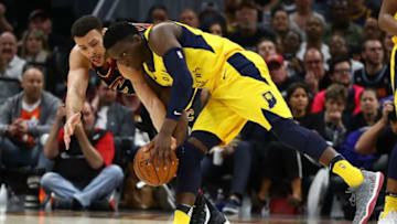 CLEVELAND, OH - APRIL 29: Victor Oladipo #4 of the Indiana Pacers battles for the ball with Larry Nance Jr. #22 of the Cleveland Cavaliers during the second half in Game Seven of the Eastern Conference Quarterfinals during the 2018 NBA Playoffs at Quicken Loans Arena on April 29, 2018 in Cleveland, Ohio. Cleveland won the game 105-101 to win there series. NOTE TO USER: User expressly acknowledges and agrees that, by downloading and or using this photograph, User is consenting to the terms and conditions of the Getty Images License Agreement. (Photo by Gregory Shamus/Getty Images)