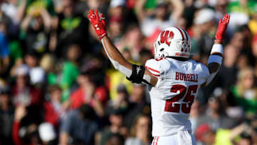 Jan 1, 2020; Pasadena, California, USA; Wisconsin Badgers cornerback Rachad Wildgoose (5) celebrates after an interception by linebacker Jack Sanborn (57) during the first half against the Oregon Ducks at the Rose Bowl Stadium. Mandatory Credit: Kelvin Kuo-USA TODAY Sports