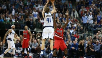 Mar 20, 2016; Dallas, TX, USA; Dallas Mavericks forward Dirk Nowitzki (41) shoots a three point basket in overtime against the Portland Trail Blazers at American Airlines Center. The Mavs beat the Trail Blazers 132-120. Mandatory Credit: Matthew Emmons-USA TODAY Sports