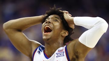 OMAHA, NE - MARCH 25: Devonte' Graham #4 of the Kansas Jayhawks reacts against the Duke Blue Devils during the second half in the 2018 NCAA Men's Basketball Tournament Midwest Regional at CenturyLink Center on March 25, 2018 in Omaha, Nebraska. (Photo by Jamie Squire/Getty Images)