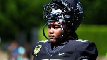 Jul 10, 2014; Beaverton, OR, USA; Defensive lineman Rashan Gary (97) looks on from the sidelines during Nike Football