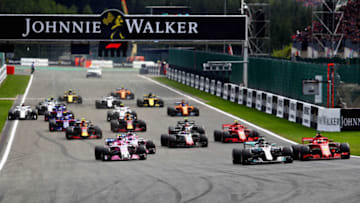 SPA, BELGIUM - AUGUST 26: Lewis Hamilton of Great Britain driving the (44) Mercedes AMG Petronas F1 Team Mercedes WO9 and Sebastian Vettel of Germany driving the (5) Scuderia Ferrari SF71H battle for position at the start during the Formula One Grand Prix of Belgium at Circuit de Spa-Francorchamps on August 26, 2018 in Spa, Belgium. (Photo by Mark Thompson/Getty Images)