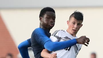 CHAUNY, FRANCE - MAY 22: Lucien Agoume of u16 France challenges Lazar Samardzic of u16 Germany during International Friendly match between U16 France and U16 Germany at Parc Joncourt Stadium on May 22, 2018 in Chauny, France. (Photo by Andreas Schlichter/Bongarts/Getty Images)