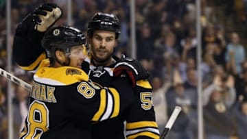Sep 22, 2015; Boston, MA, USA; Boston Bruins defenseman Adam McQuaid (54) congratulates right wing David Pastrnak (88) after scoring a goal on Washington Capitals goalie Philipp Grubauer (31) during the third period at TD Garden. The Boston Bruins won 2-1 in overtime. Mandatory Credit: Greg M. Cooper-USA TODAY Sports
