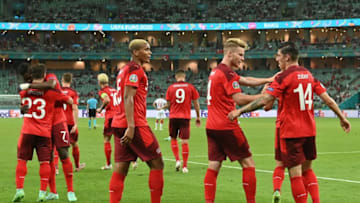 Switzerland players celebrate a goal against Turkey (Photo by OZAN KOSE/POOL/AFP via Getty Images)