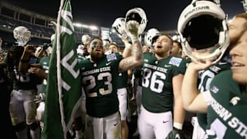 SAN DIEGO, CA - DECEMBER 28: Chris Frey #23 and Drew Beesley #86 of the Michigan State Spartans of the Michigan State Spartans celebrate defeating the Washington State Cougars 42-17 in the SDCCU Holiday Bowl at SDCCU Stadium on December 28, 2017 in San Diego, California. (Photo by Sean M. Haffey/Getty Images)