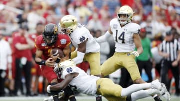 ORLANDO, FL - DECEMBER 28: Re-al Mitchell #6 of the Iowa State Cyclones gets tackled by Notre Dame Fighting Irish defenders in the second half of the Camping World Bowl at Camping World Stadium on December 28, 2019 in Orlando, Florida. Notre Dame defeated Iowa State 33-9. (Photo by Joe Robbins/Getty Images)
