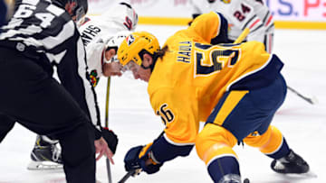 Jan 26, 2021; Nashville, Tennessee, USA; Nashville Predators left wing Erik Haula (56) faces off against Chicago Blackhawks right wing Andrew Shaw (65) during the second period at Bridgestone Arena. Mandatory Credit: Christopher Hanewinckel-USA TODAY Sports