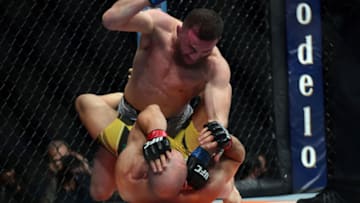 Sep 25, 2021; Las Vegas, Nevada, USA; Merab Dvalishvili lands a hit against Marlon Moraes during UFC 266 at T-Mobile Arena. Mandatory Credit: Gary A. Vasquez-USA TODAY Sports