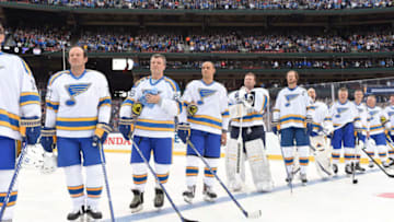 ST LOUIS, MO - DECEMBER 31: (L-R) Terry Yake #27, Peter Stastny #26, Bryce Salvador #27, Martin Brodeur #31, Chris Pronger #44, Chris Mason #50, Kelly Chase #39, Pierre Turgeon #77, Brett Hull #16 and Wayne Gretzky #99 of the St. Louis Blues line up at the blue line prior to the 2017 Bridgestone NHL Winter Classic Alumni Game at Busch Stadium on December 31, 2016 in St Louis, Missouri. (Photo by Brian Babineau/NHLI via Getty Images)