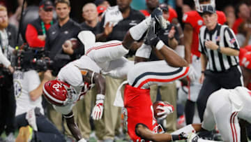 ATLANTA, GA - DECEMBER 01: Dylan Moses #32 and Saivion Smith #4 of the Alabama Crimson Tide tackle Tyler Simmons #87 of the Georgia Bulldogs in the first half during the 2018 SEC Championship Game at Mercedes-Benz Stadium on December 1, 2018 in Atlanta, Georgia. (Photo by Kevin C. Cox/Getty Images)