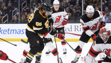 Jan 4, 2022; Boston, Massachusetts, USA; Boston Bruins right wing David Pastrnak (88) shoots the puck past New Jersey Devils goaltender Mackenzie Blackwood (29) during the third period at TD Garden. Mandatory Credit: Bob DeChiara-USA TODAY Sports