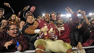 Nov 26, 2016; Tallahassee, FL, USA; Florida State Seminoles defensive end Demarcus Walker (44) celebrates after the Seminoles beat the Florida Gators at Doak Campbell Stadium. Mandatory Credit: Melina Vastola-USA TODAY Sports