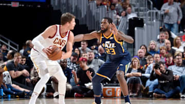 CLEVELAND, OH - DECEMBER 16: Kyle Korver #26 of the Cleveland Cavaliers handles the ball against Royce O'Neale #23 of the Utah Jazz during the game between the two teams on December 16. 2017 at Quicken Loans Arena in Cleveland, Ohio. NOTE TO USER: User expressly acknowledges and agrees that, by downloading and/or using this Photograph, user is consenting to the terms and conditions of the Getty Images License Agreement. Mandatory Copyright Notice: Copyright 2017 NBAE (Photo by David Liam Kyle/NBAE via Getty Images)