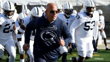 COLLEGE PARK, MARYLAND - NOVEMBER 06: Head coach James Franklin of the Penn State Nittany Lions leads his team onto the field before the game against the Maryland Terrapins at Capital One Field at Maryland Stadium on November 06, 2021 in College Park, Maryland. (Photo by G Fiume/Getty Images)