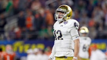 ARLINGTON, TEXAS - DECEMBER 29: Ian Book #12 of the Notre Dame Fighting Irish reacts after a play in the second half against the Clemson Tigers during the College Football Playoff Semifinal Goodyear Cotton Bowl Classic at AT&T Stadium on December 29, 2018 in Arlington, Texas. (Photo by Tim Warner/Getty Images)