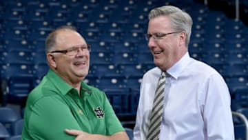 Nov 29, 2016; South Bend, IN, USA; Notre Dame Fighting Irish trainer Skip Meyer and Iowa Hawkeyes head coach Fran McCaffery chat before the game at the Purcell Pavilion. Mandatory Credit: Matt Cashore-USA TODAY Sports