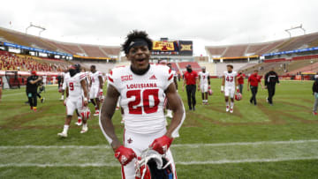 AMES, IA - SEPTEMBER 12: Running back Emani Bailey #20 of the Louisiana-Lafayette Ragin Cajuns celebrates with his teammates as he leave the field after the Louisiana-Lafayette Ragin Cajuns defeated the Iowa State Cyclones 31-14 at Jack Trice Stadium on September 12, 2020 in Ames, Iowa. The Louisiana-Lafayette Ragin Cajuns won 31-14 over the Iowa State Cyclones. (Photo by David K Purdy/Getty Images)