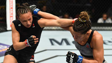 GLENDALE, AZ - APRIL 14: (R-L) Cortney Casey exchanges punches with Michelle Waterson in their womens strawweight fight during the UFC Fight Night event at the Gila Rivera Arena on April 14, 2018 in Glendale, Arizona. (Photo by Josh Hedges/Zuffa LLC/Zuffa LLC via Getty Images)