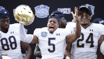 ORLANDO, FL - DECEMBER 28: Troy Pride Jr. #5 of the Notre Dame Fighting Irish celebrates following the Camping World Bowl against the Iowa State Cyclones at Camping World Stadium on December 28, 2019 in Orlando, Florida. Notre Dame defeated Iowa State 33-9. (Photo by Joe Robbins/Getty Images)