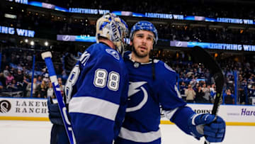 TAMPA, FL - MARCH 5: Goalie Andrei Vasilevskiy #88 and Cedric Paquette #13 of the Tampa Bay Lightning celebrate the win against the Winnipeg Jets at Amalie Arena on March 5, 2019 in Tampa, Florida. (Photo by Scott Audette/NHLI via Getty Images)