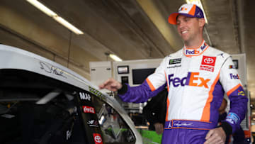 FORT WORTH, TEXAS - NOVEMBER 01: Denny Hamlin, driver of the #11 FedEx Office Toyota, stands in the garage area during practice for the Monster Energy NASCAR Cup Series AAA Texas 500 at Texas Motor Speedway on November 01, 2019 in Fort Worth, Texas. (Photo by Chris Graythen/Getty Images)