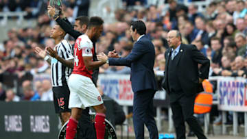 NEWCASTLE UPON TYNE, ENGLAND - SEPTEMBER 15: Pierre-Emerick Aubameyang of Arsenal shakes hands with Unai Emery, Manager of Arsenal during the Premier League match between Newcastle United and Arsenal FC at St. James Park on September 15, 2018 in Newcastle upon Tyne, United Kingdom. (Photo by Alex Livesey/Getty Images)