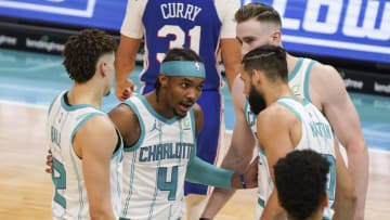 Feb 3, 2021; Charlotte, North Carolina, USA; Charlotte Hornets guard Devonte' Graham (4) gathers with teammates guard LaMelo Ball (2), forward Gordon Hayward (20) and forward Caleb Martin (10) at the free throw line during the second half at Spectrum Center. Mandatory Credit: Jim Dedmon-USA TODAY Sports
