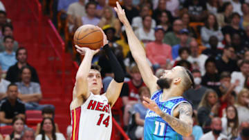 MIAMI, FLORIDA - APRIL 05: Tyler Herro #14 of the Miami Heat shoots over Cody Martin #11 of the Charlotte Hornets during the second half at FTX Arena on April 05, 2022 in Miami, Florida. NOTE TO USER: User expressly acknowledges and agrees that, by downloading and or using this photograph, User is consenting to the terms and conditions of the Getty Images License Agreement. (Photo by Michael Reaves/Getty Images)