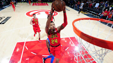 ATLANTA, GA - DECEMBER 9: Kent Bazemore #24 of the Atlanta Hawks dunks the ball against the Orlando Magic on December 9, 2017 at Philips Arena in Atlanta, Georgia. NOTE TO USER: User expressly acknowledges and agrees that, by downloading and/or using this photograph, user is consenting to the terms and conditions of the Getty Images License Agreement. Mandatory Copyright Notice: Copyright 2017 NBAE (Photo by Scott Cunningham/NBAE via Getty Images)