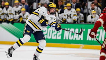 Michigan defenseman Owen Power shoots the puck against Denver during the first period of the Frozen Four semifinal at the TD Garden in Boston, Mass. on Thursday, April 7, 2022.