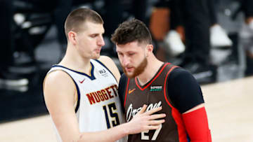 Nikola Jokic, Denver Nuggets and Jusuf Nurkic, Portland Trail Blazers greet one another before Round 1, Game 6 of the 2021 NBA Playoffs. (Photo by Steph Chambers/Getty Images)