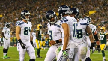 Sep 20, 2015; Green Bay, WI, USA; Seattle Seahawks quarterback Russell Wilson (3) celebrates his touchdown pass with teammates during the second half against the Green Bay Packers at Lambeau Field. Mandatory Credit: Ray Carlin-USA TODAY Sports