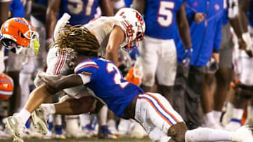 Florida Gators linebacker Amari Burney (2) tackles Utah Utes running back Micah Bernard (2) in the second half at Steve Spurrier Field at Ben Hill Griffin Stadium in Gainesville, FL on Saturday, September 3, 2022. Florida beat Utah 29-26. [Doug Engle/Gainesville Sun]Ncaa Football Florida Gators Vs Utah Utes